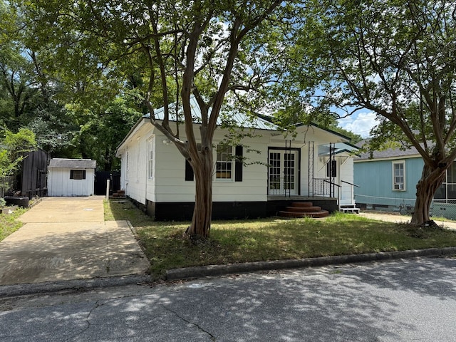 1509 12th St, Phenix City, AL 36867 - view of front of property featuring french doors and a storage unit