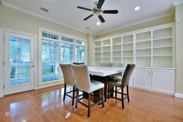 4701 Turnberry Ln Unit 12, Columbus, GA 31909 - dining room with light wood-type flooring, a ceiling fan, visible vents, and ornamental molding