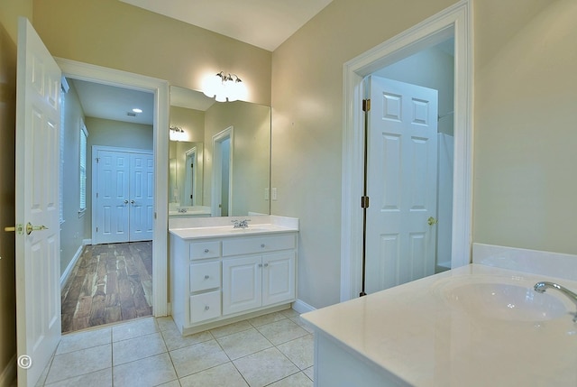 4701 Turnberry Ln Unit 12, Columbus, GA 31909 - bathroom featuring two vanities, baseboards, and a sink