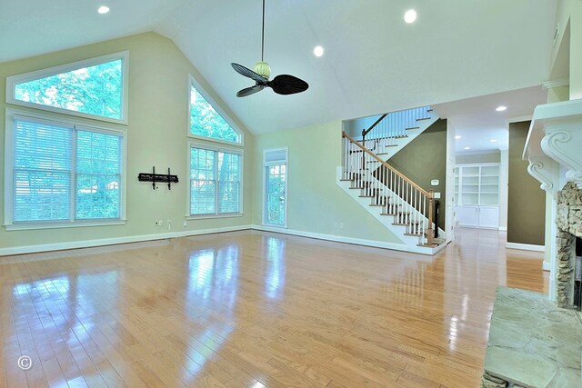 4701 Turnberry Ln Unit 12, Columbus, GA 31909 - unfurnished living room featuring high vaulted ceiling, ceiling fan, baseboards, and wood finished floors