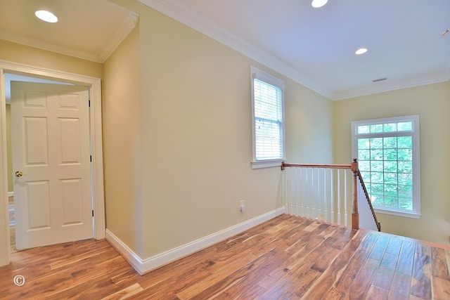 4701 Turnberry Ln Unit 12, Columbus, GA 31909 - corridor with light wood-style flooring, a wealth of natural light, ornamental molding, and an upstairs landing