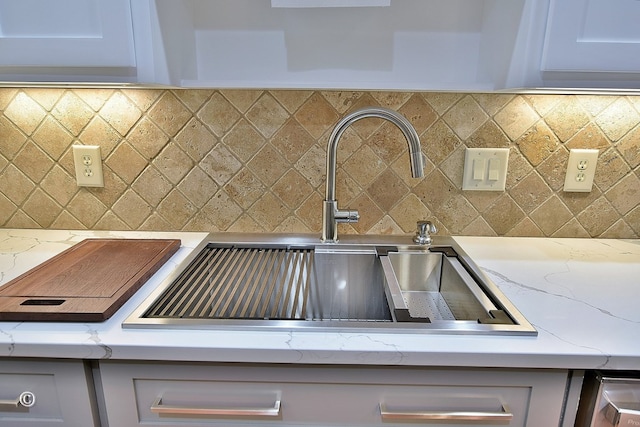 4701 Turnberry Ln Unit 12, Columbus, GA 31909 - details with light stone countertops, gray cabinets, decorative backsplash, and a sink