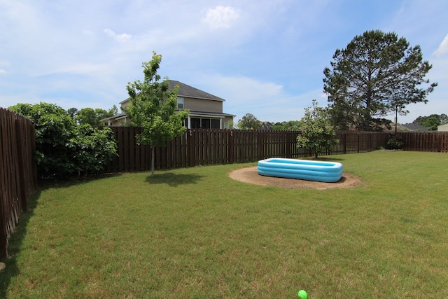 view of yard with a fenced backyard