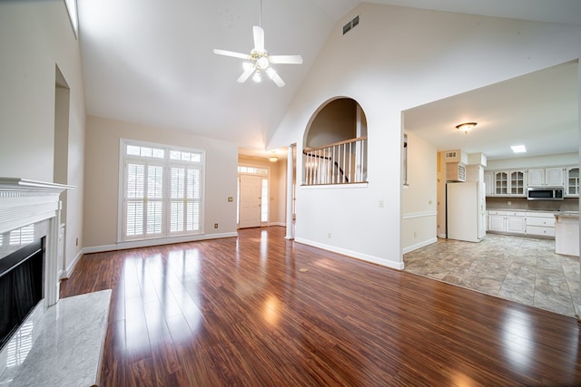 4854 Champions Way, Columbus, GA 31909 - unfurnished living room with high vaulted ceiling, ceiling fan, a premium fireplace, and light wood finished floors