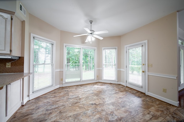 4854 Champions Way, Columbus, GA 31909 - unfurnished dining area featuring ceiling fan and stone finish flooring