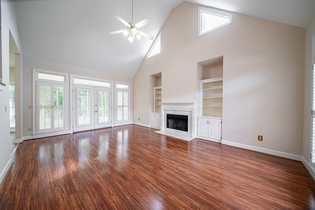 4854 Champions Way, Columbus, GA 31909 - unfurnished living room with built in shelves, a ceiling fan, high vaulted ceiling, a high end fireplace, and dark wood-type flooring