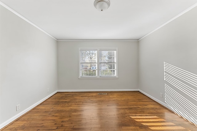 unfurnished room with crown molding and hardwood / wood-style floors