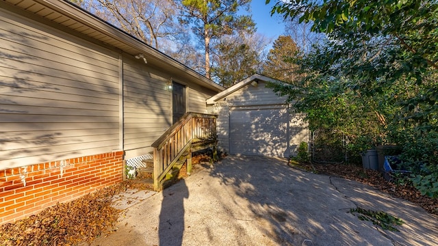 view of home's exterior with an outdoor structure and a garage