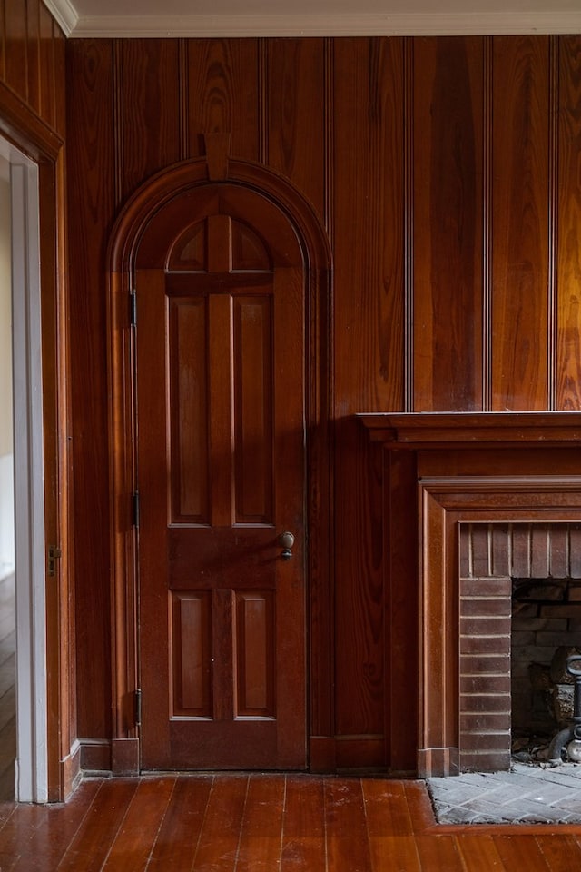 interior details with wood walls and wood finished floors