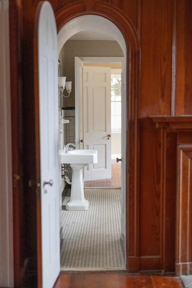 hall featuring arched walkways