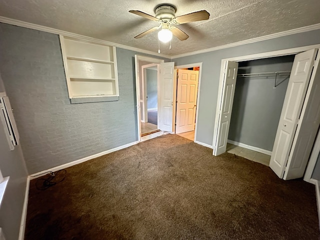 unfurnished bedroom with ceiling fan, crown molding, carpet floors, a textured ceiling, and a closet