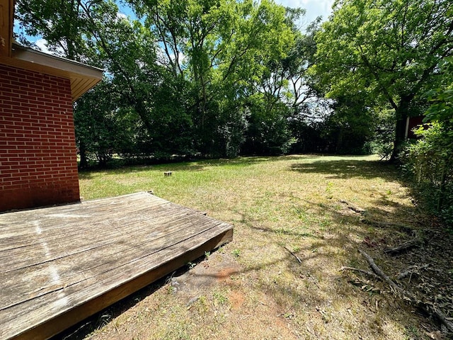 view of yard featuring a wooden deck