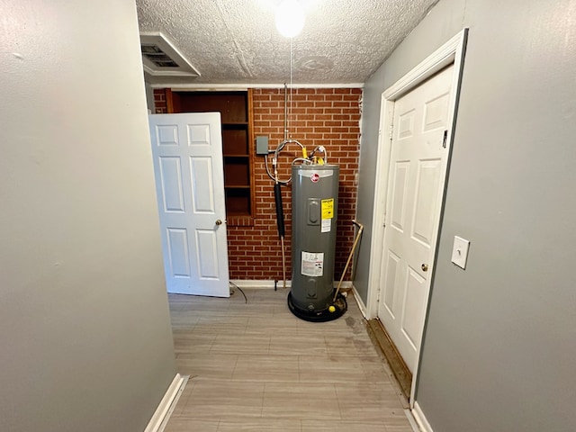 utility room featuring electric water heater