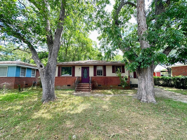 single story home featuring a front yard