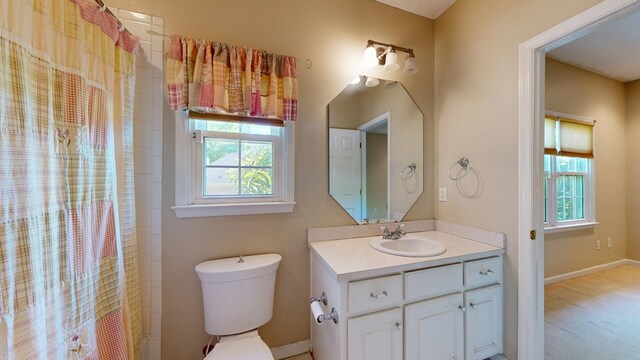 5007 Spyglass Ct, Columbus, GA 31909 - bathroom with toilet, a shower with shower curtain, vanity, and baseboards