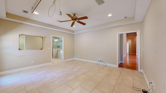 5007 Spyglass Ct, Columbus, GA 31909 - spare room with a raised ceiling, light tile patterned floors, a ceiling fan, and visible vents