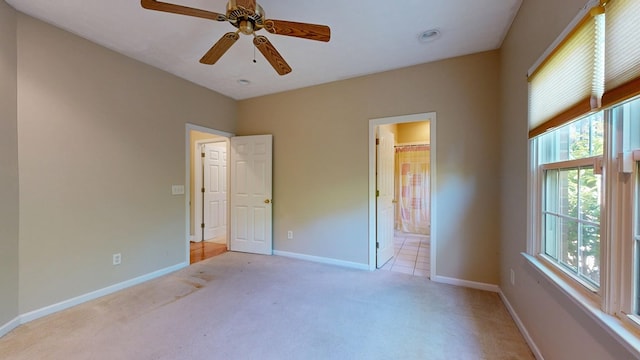 5007 Spyglass Ct, Columbus, GA 31909 - unfurnished bedroom with baseboards, multiple windows, light colored carpet, and a ceiling fan