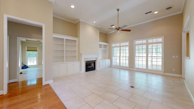 5007 Spyglass Ct, Columbus, GA 31909 - unfurnished living room with a fireplace, baseboards, a ceiling fan, and crown molding
