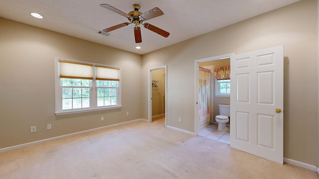 5007 Spyglass Ct, Columbus, GA 31909 - unfurnished bedroom with visible vents, baseboards, a walk in closet, connected bathroom, and light colored carpet