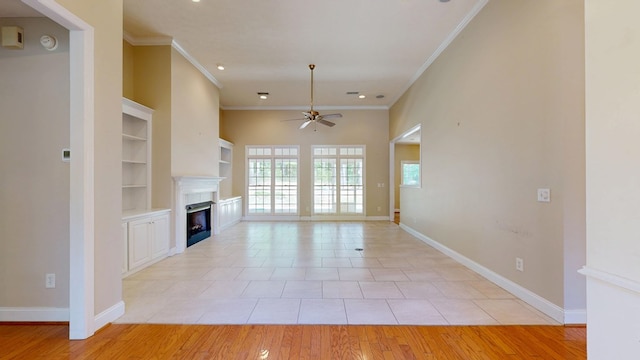 5007 Spyglass Ct, Columbus, GA 31909 - unfurnished living room with built in features, baseboards, a ceiling fan, and a fireplace
