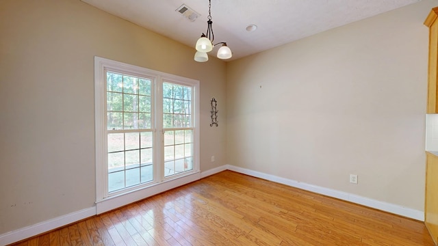 5007 Spyglass Ct, Columbus, GA 31909 - spare room with light wood-style floors, an inviting chandelier, baseboards, and visible vents