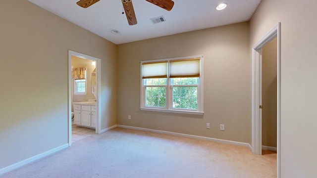 5007 Spyglass Ct, Columbus, GA 31909 - unfurnished bedroom featuring visible vents, baseboards, connected bathroom, and light colored carpet