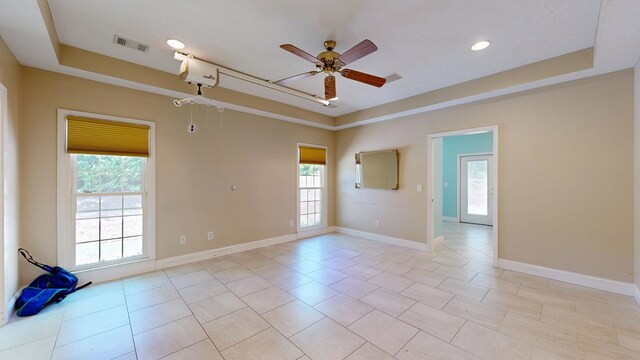 5007 Spyglass Ct, Columbus, GA 31909 - spare room featuring visible vents, a raised ceiling, and a ceiling fan