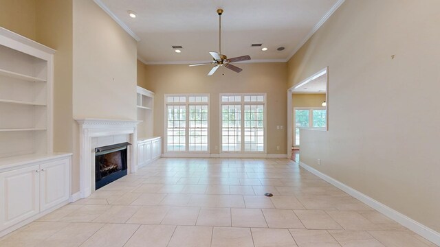5007 Spyglass Ct, Columbus, GA 31909 - unfurnished living room featuring baseboards, ornamental molding, a fireplace, ceiling fan, and built in shelves