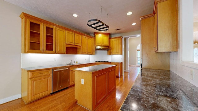 5007 Spyglass Ct, Columbus, GA 31909 - kitchen featuring a center island, dishwasher, a sink, a wealth of natural light, and under cabinet range hood