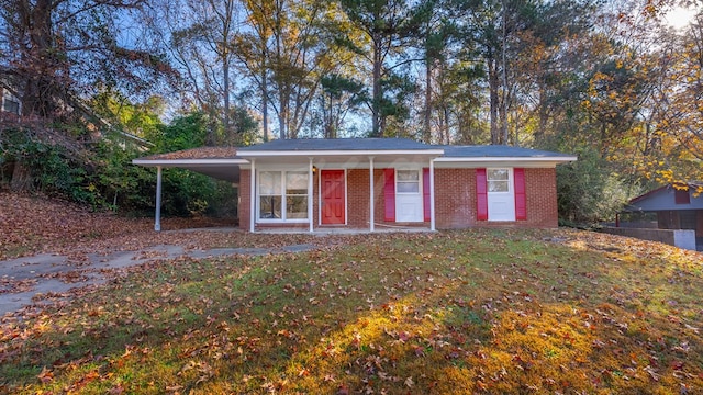 view of outbuilding featuring a carport and a lawn