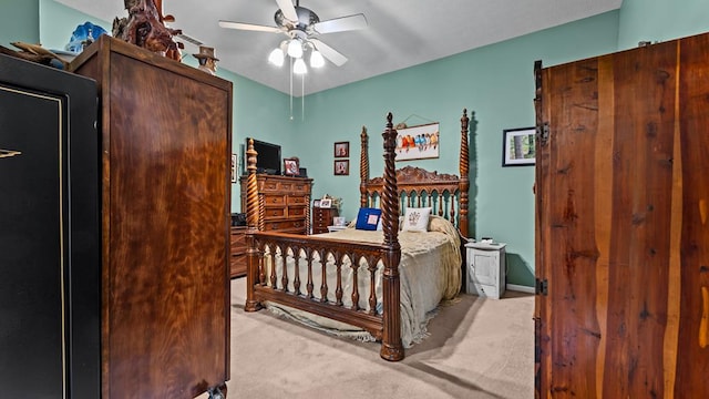 bedroom featuring light carpet and ceiling fan