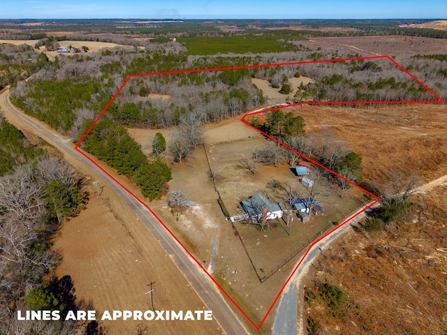 birds eye view of property with a rural view