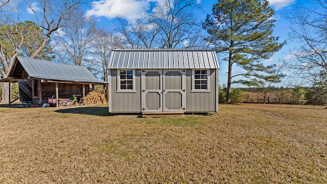 view of outbuilding featuring a lawn