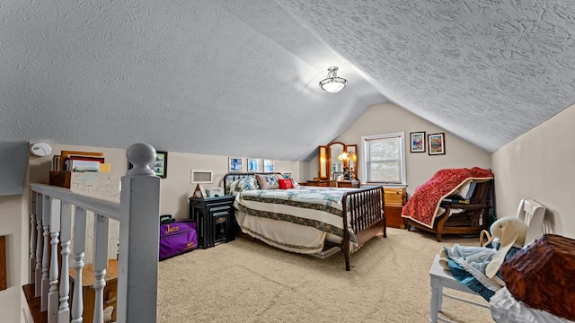 bedroom featuring vaulted ceiling, carpet, and a textured ceiling