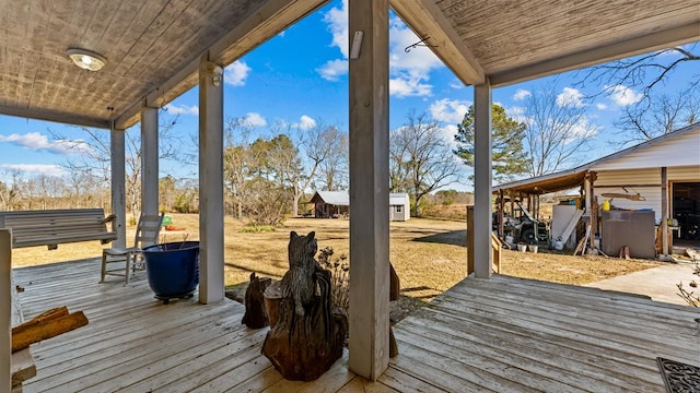 wooden deck with an outbuilding