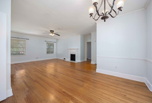 1712 Marilon Dr, Columbus, GA 31906 - unfurnished living room with ceiling fan, a chandelier, ornamental molding, light wood-type flooring, and baseboards