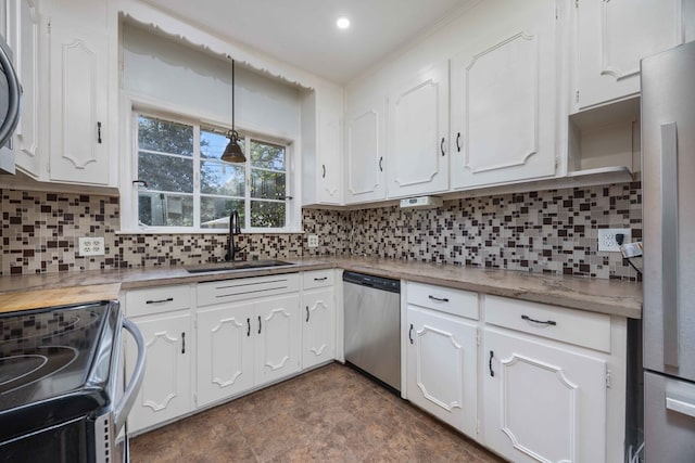 1712 Marilon Dr, Columbus, GA 31906 - kitchen featuring stainless steel appliances, a sink, white cabinets, and backsplash