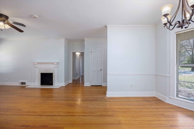 1712 Marilon Dr, Columbus, GA 31906 - unfurnished living room featuring ornamental molding, a chandelier, light wood finished floors, a ceiling fan, and a fireplace