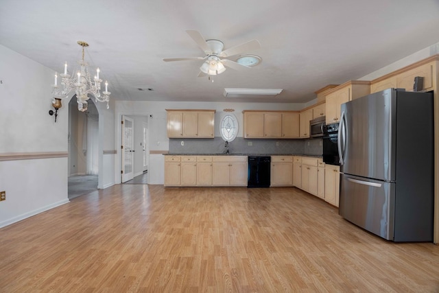 kitchen with tasteful backsplash, appliances with stainless steel finishes, light wood-style floors, light brown cabinets, and a sink