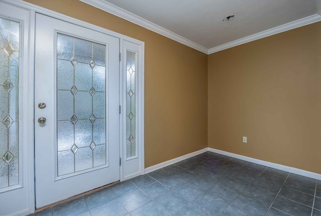 foyer entrance with dark tile patterned floors, baseboards, and ornamental molding