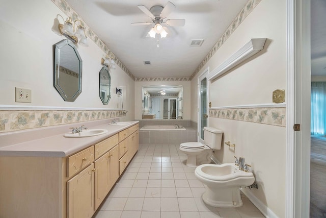 full bathroom with tile patterned flooring, toilet, a relaxing tiled tub, visible vents, and a bidet