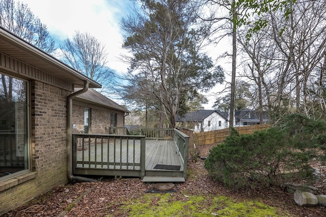 view of yard with fence and a wooden deck