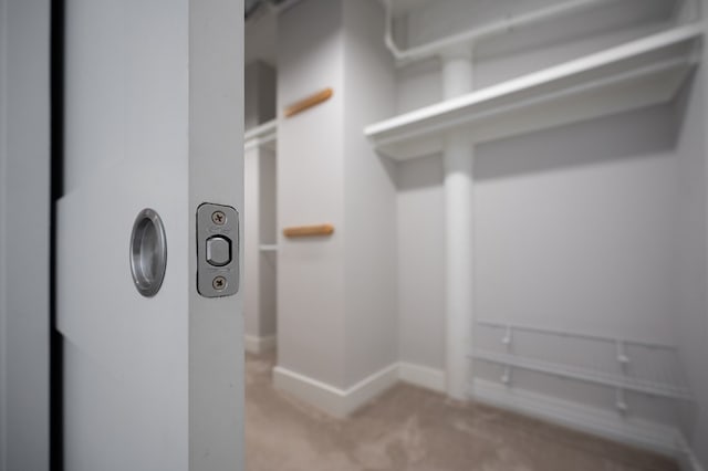 interior space featuring carpet flooring and baseboards