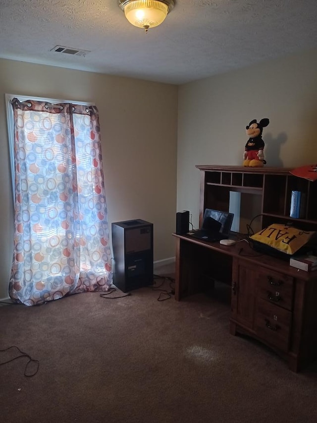 office with carpet flooring and a textured ceiling