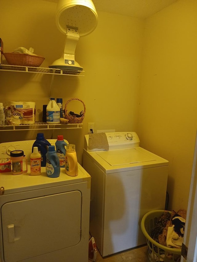 laundry room with separate washer and dryer