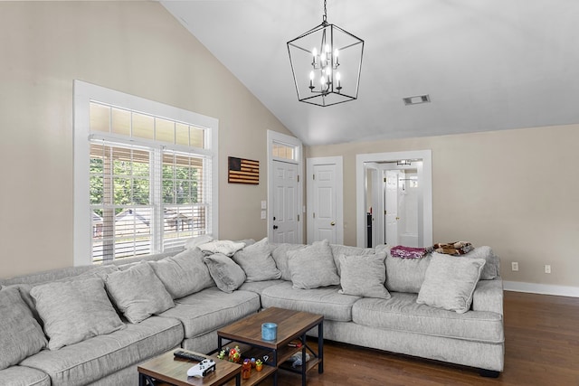 living room featuring baseboards, dark wood-type flooring, visible vents, and a chandelier