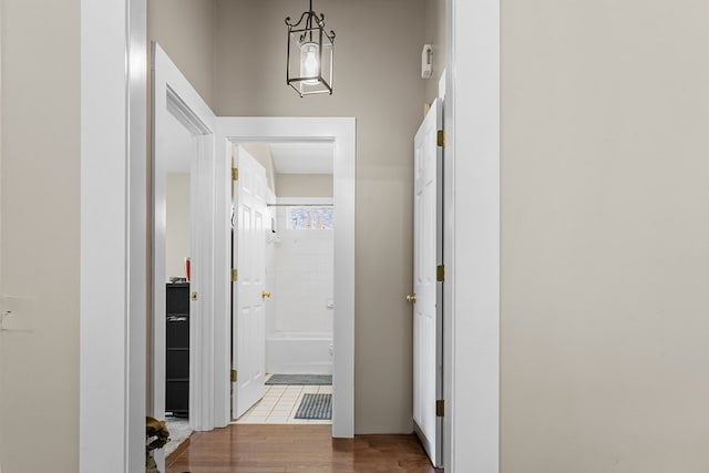 corridor featuring wood finished floors