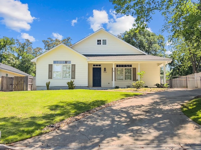 view of front of home featuring a gate, a front lawn, fence, and a porch