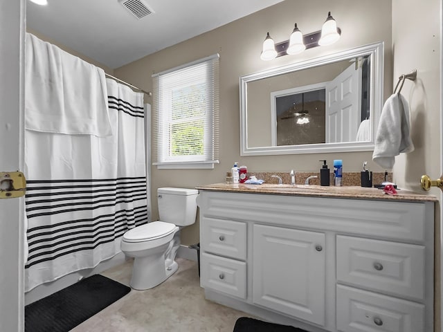 bathroom featuring a shower with curtain, visible vents, vanity, and toilet