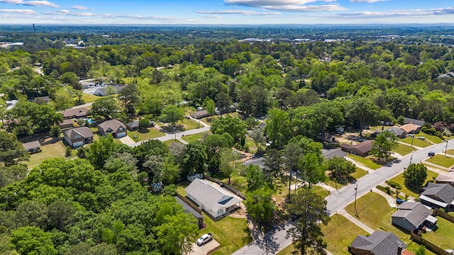 bird's eye view with a residential view and a wooded view